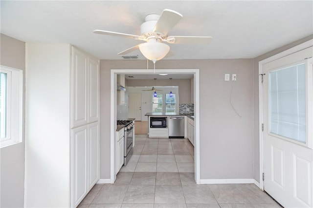 kitchen featuring white cabinets, a ceiling fan, appliances with stainless steel finishes, and visible vents