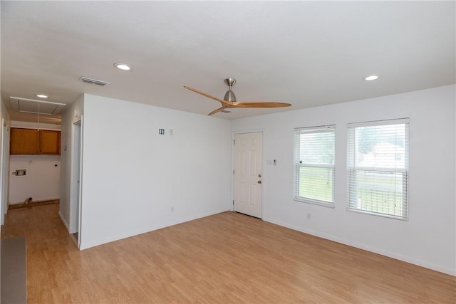 spare room featuring ceiling fan, light wood-style floors, attic access, recessed lighting, and visible vents