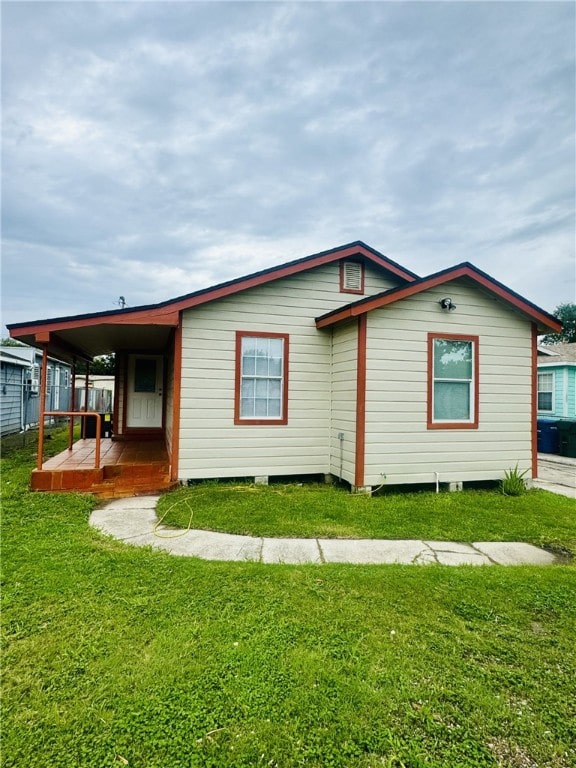 view of home's exterior with a yard