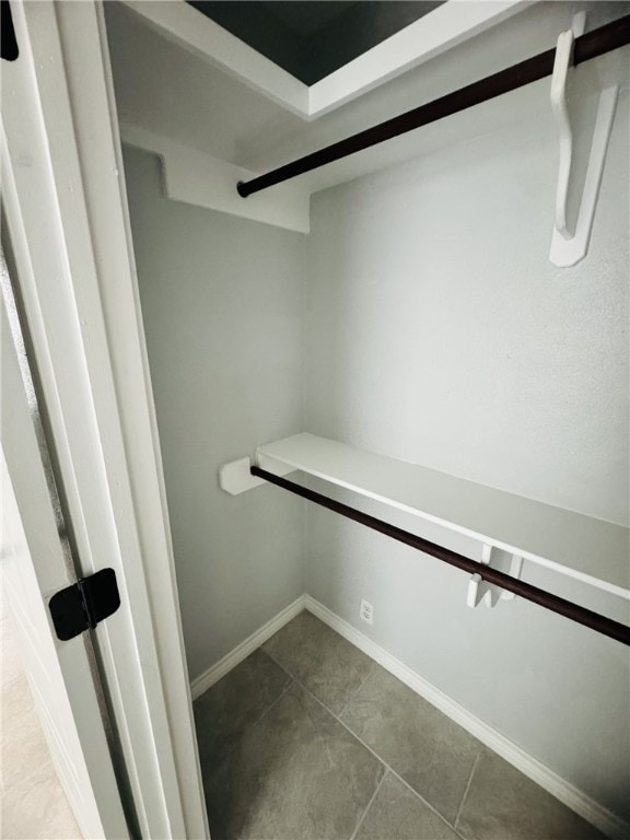 spacious closet featuring tile patterned floors