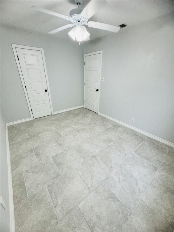 spare room featuring ceiling fan