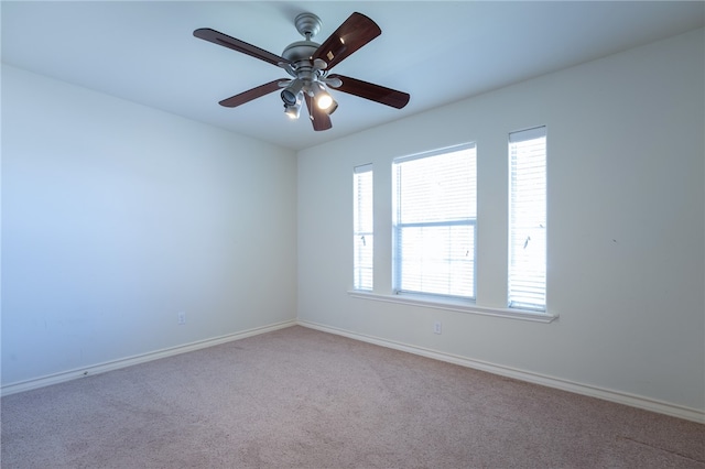 empty room featuring carpet and ceiling fan