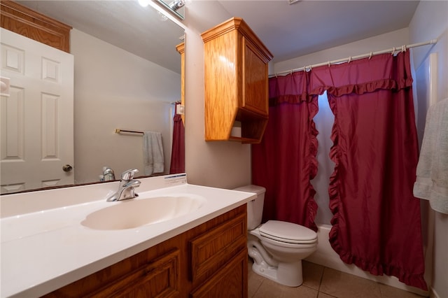 full bathroom with tile patterned floors, vanity, shower / bath combo, and toilet