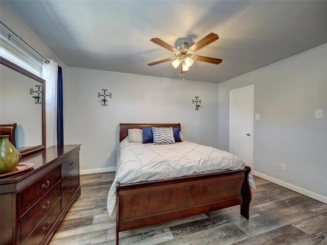 bedroom featuring hardwood / wood-style flooring and ceiling fan