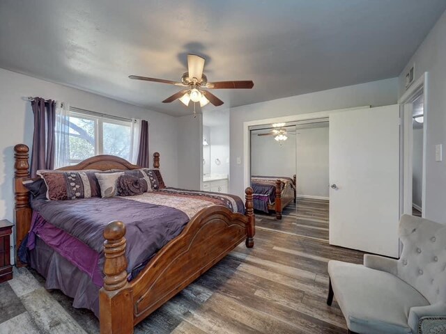 bedroom with a closet, wood-type flooring, ceiling fan, and ensuite bathroom