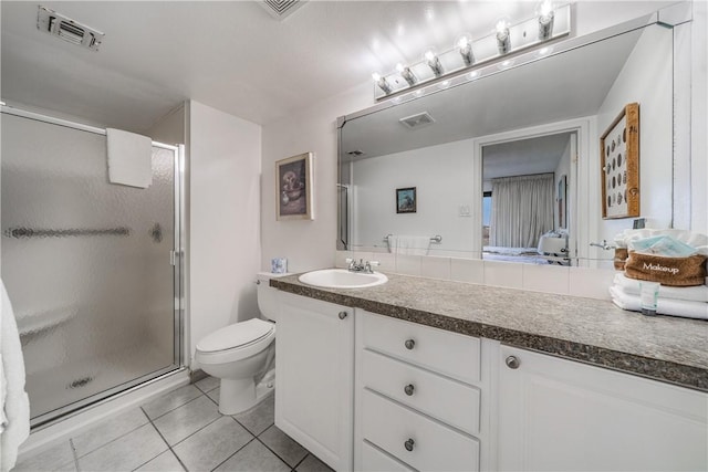 bathroom with tile patterned floors, toilet, visible vents, and a shower stall
