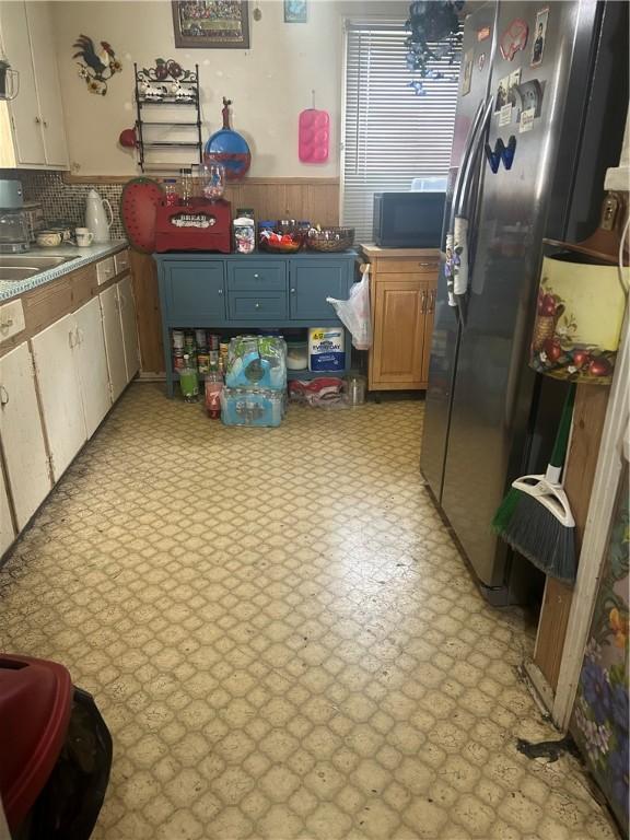 kitchen featuring sink and stainless steel fridge