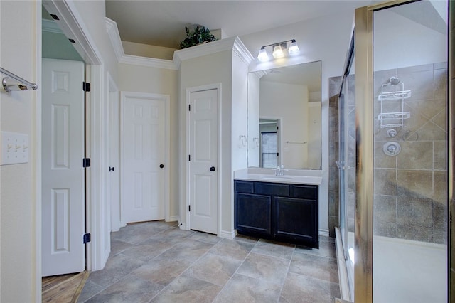 bathroom with vanity and tiled shower