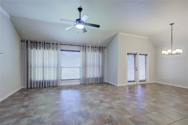 empty room with french doors, ornamental molding, vaulted ceiling, and ceiling fan with notable chandelier