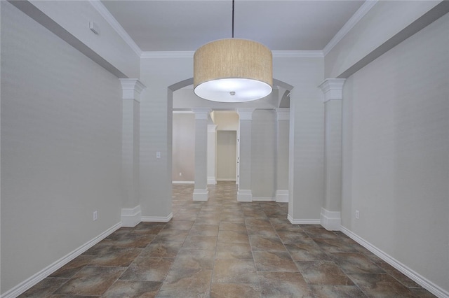 unfurnished dining area featuring crown molding and decorative columns