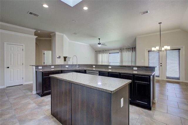 7505 Long S Dr, Corpus Christi, TX 78414 - kitchen featuring a sink, a spacious island, ornamental molding, ceiling fan, and baseboards
