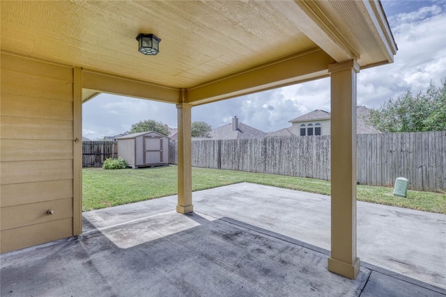 view of patio with a storage shed