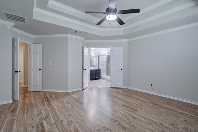 7505 Long S Dr, Corpus Christi, TX 78414 - unfurnished bedroom with a raised ceiling, light wood finished floors, baseboards, and ornamental molding