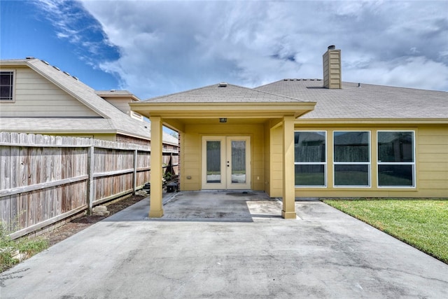 rear view of house with a patio and french doors