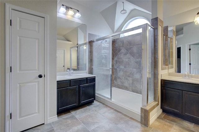 7505 Long S Dr, Corpus Christi, TX 78414 - full bath with vaulted ceiling, a shower stall, and two vanities