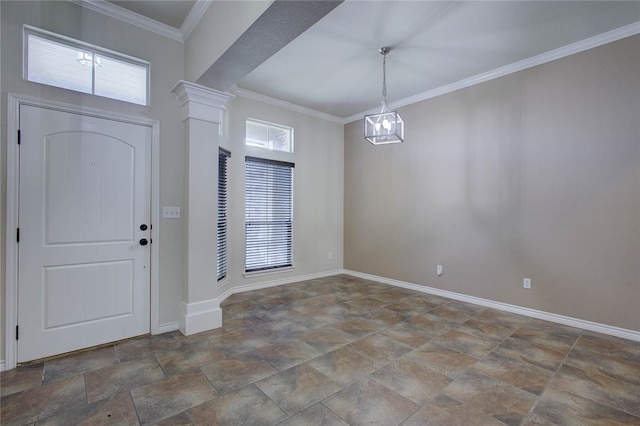 entryway with crown molding, decorative columns, and a chandelier