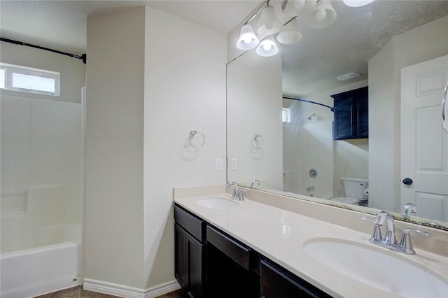 7505 Long S Dr, Corpus Christi, TX 78414 - bathroom featuring toilet, shower / bath combination, double vanity, and baseboards