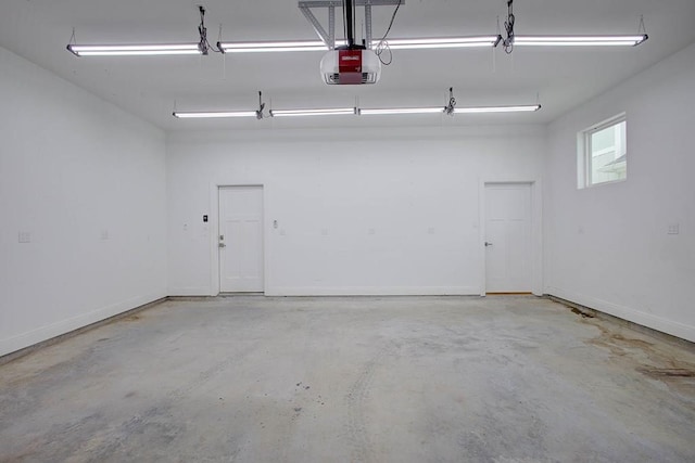 garage featuring baseboards and a garage door opener