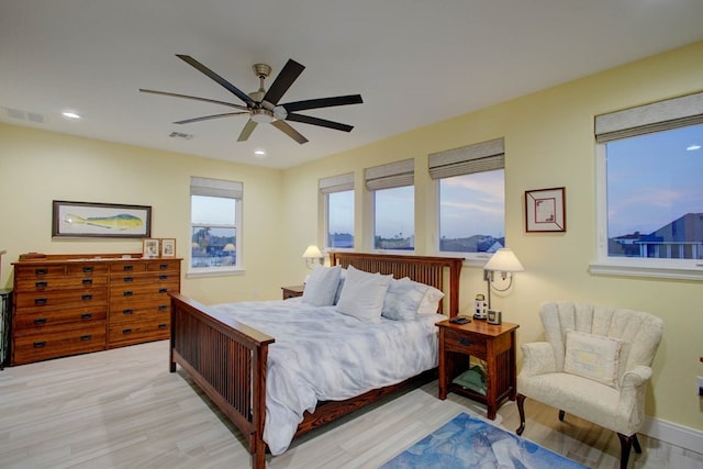 bedroom with recessed lighting, visible vents, ceiling fan, and wood finished floors