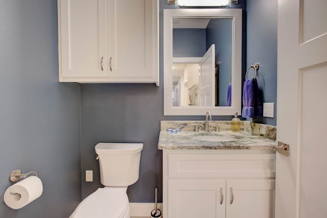 half bath with toilet and vanity