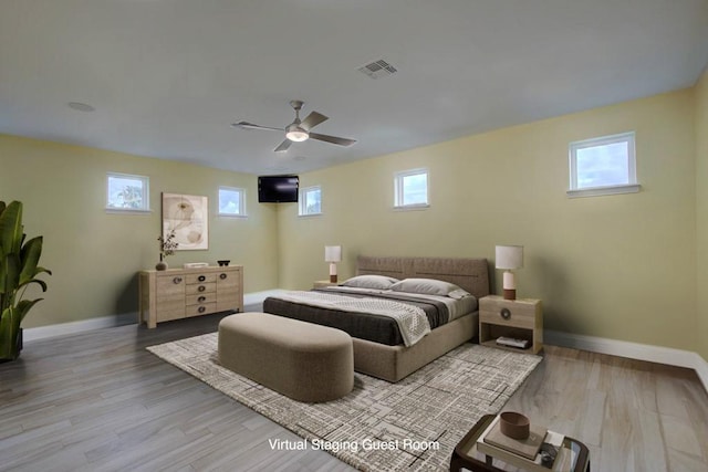102 Angelfish Ct, Aransas Pass, TX 78336 - bedroom with baseboards, wood finished floors, and a ceiling fan