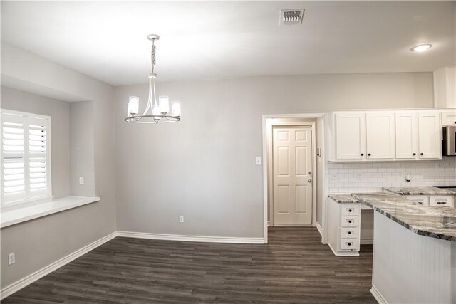 100 Lone Oak St, Portland, TX 78374 - unfurnished dining area featuring dark wood-style floors, a chandelier, and baseboards