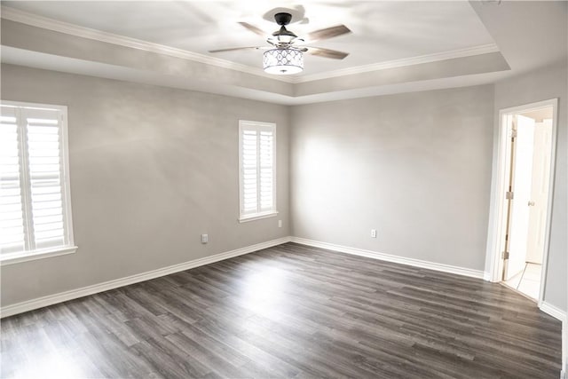 100 Lone Oak St, Portland, TX 78374 - empty room featuring a tray ceiling, a ceiling fan, dark wood-style floors, ornamental molding, and baseboards