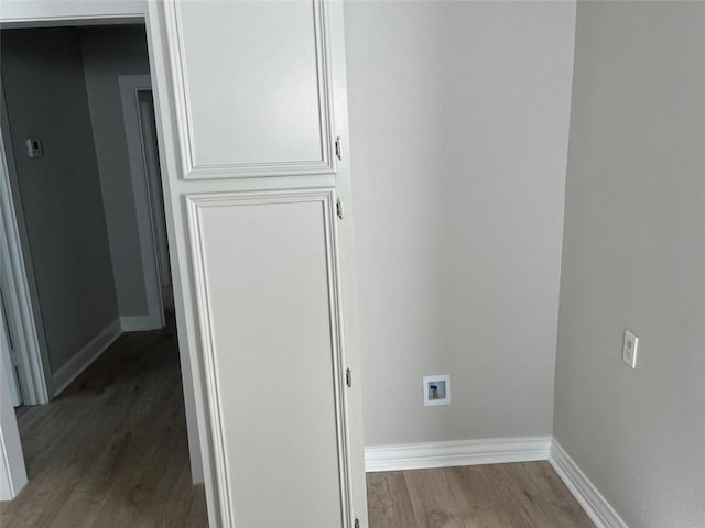 laundry area featuring hardwood / wood-style floors