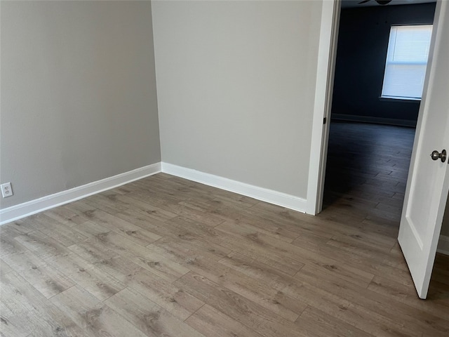 spare room with light hardwood / wood-style floors