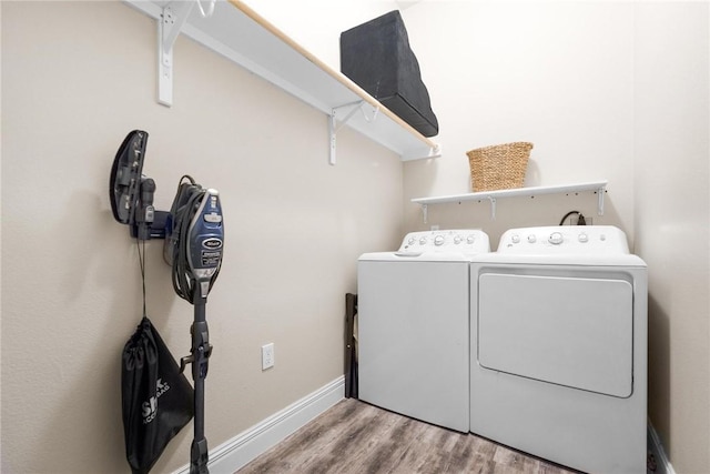 133 Barnacle Dr, Rockport, TX 78382 - laundry area featuring laundry area, wood finished floors, baseboards, and separate washer and dryer