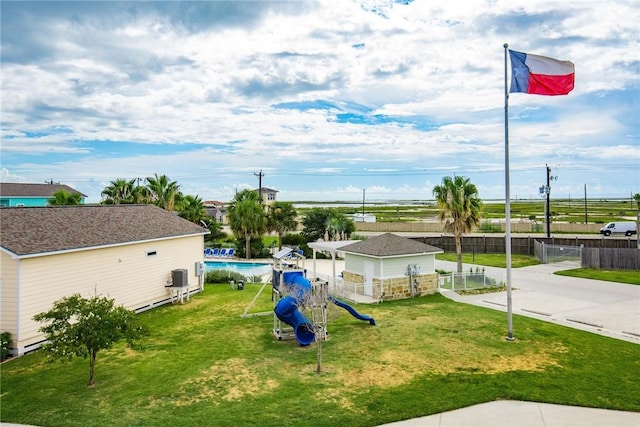 133 Barnacle Dr, Rockport, TX 78382 - view of yard with a fenced in pool, a playground, central AC, and fence