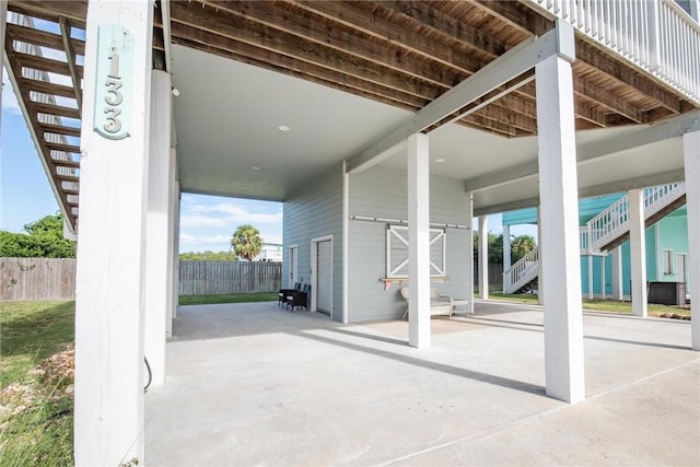 133 Barnacle Dr, Rockport, TX 78382 - view of patio / terrace featuring stairs and fence