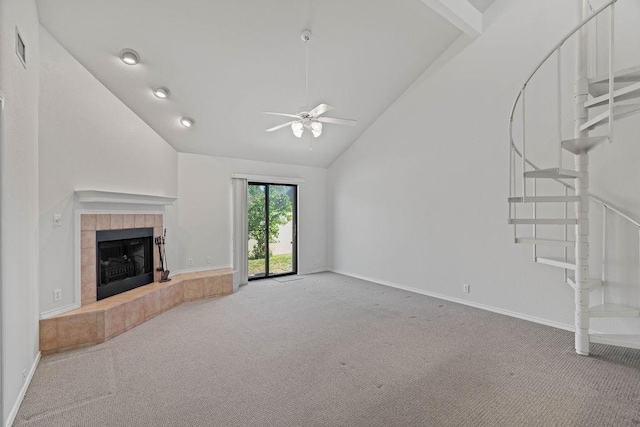 unfurnished living room with a fireplace, high vaulted ceiling, ceiling fan, and carpet