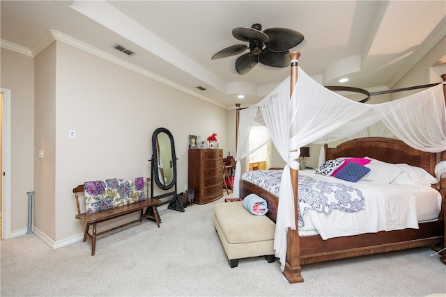 carpeted bedroom featuring ceiling fan and crown molding