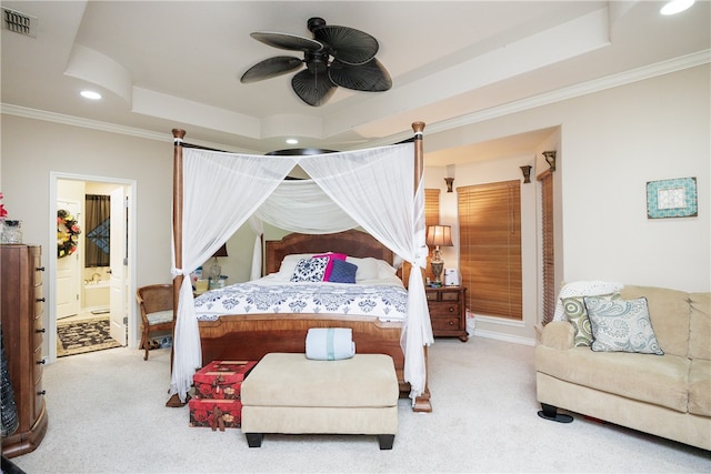 bedroom featuring ensuite bathroom, ceiling fan, and light carpet