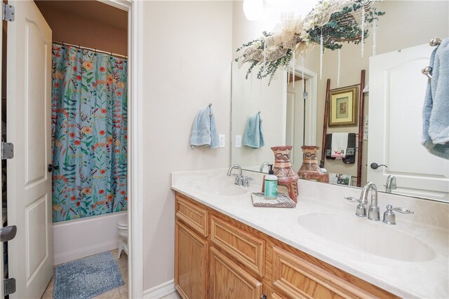 full bathroom with shower / bath combo, toilet, vanity, and tile patterned floors