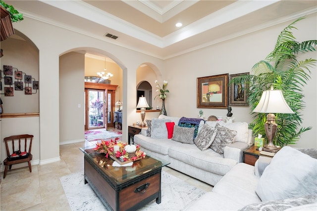 tiled living room with crown molding and a notable chandelier