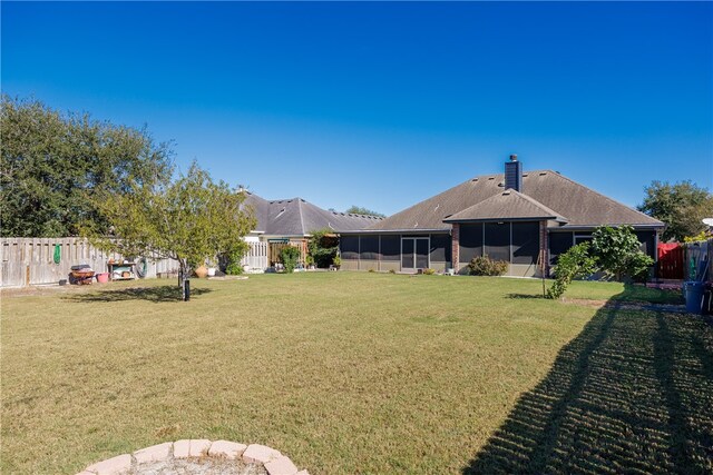 view of yard featuring a sunroom