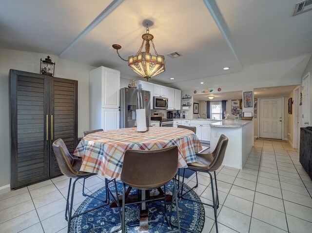 dining area featuring light tile patterned floors