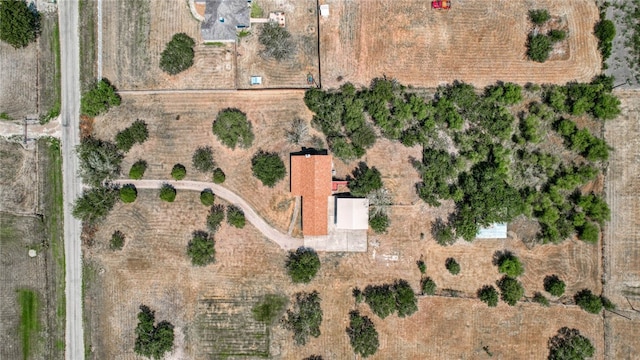 birds eye view of property with a rural view