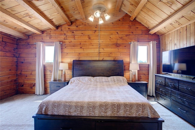 carpeted bedroom featuring lofted ceiling with beams, wood walls, and wooden ceiling