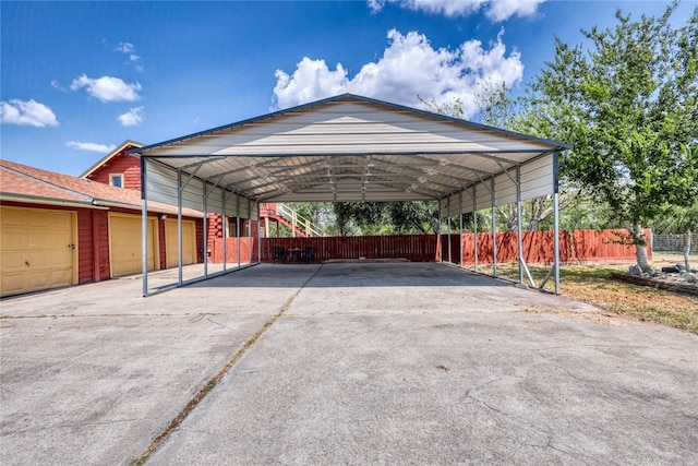 view of car parking featuring a garage and a carport