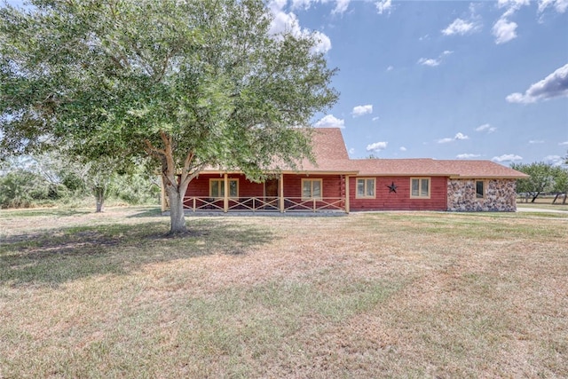 rear view of house with a yard