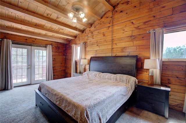 bedroom with carpet, french doors, vaulted ceiling with beams, and wood ceiling