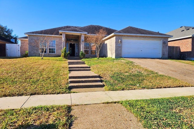 3909 Alta Vista Dr, Corpus Christi, TX 78410 - view of front facade featuring driveway, a garage, and brick siding