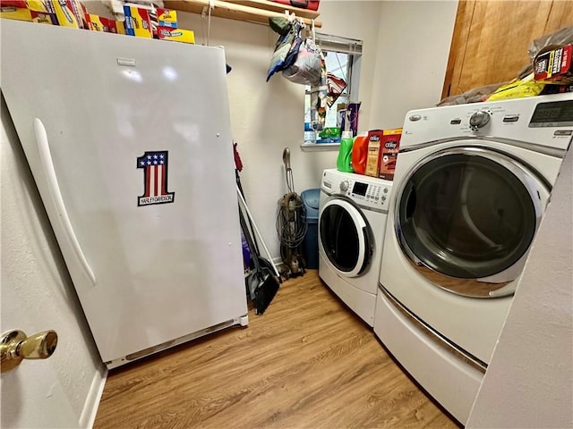1510 Skyline Dr, Portland, TX 78374 - washroom with washing machine and dryer and light wood-style flooring