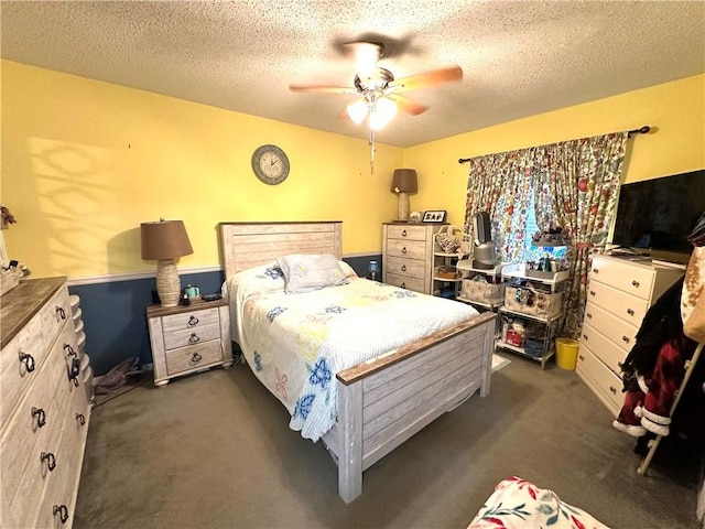 1510 Skyline Dr, Portland, TX 78374 - bedroom featuring dark carpet, a textured ceiling, a ceiling fan, and a wainscoted wall