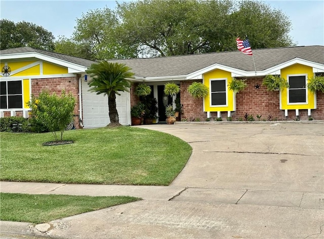 1510 Skyline Dr, Portland, TX 78374 - view of front of home with brick siding, an attached garage, a front lawn, driveway, and roof with shingles
