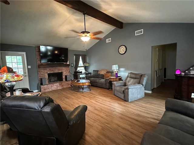 1510 Skyline Dr, Portland, TX 78374 - living area with wood finished floors, a ceiling fan, and a fireplace