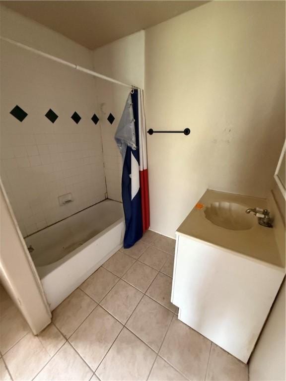 bathroom featuring shower / bath combo with shower curtain, tile patterned floors, and vanity
